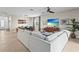 Open concept living room with sectional sofa and dining area at 5107 Coral Reef Way, Bradenton, FL 34211