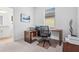 Home office featuring a large desk, chair and adjacent bathroom access at 5107 Coral Reef Way, Bradenton, FL 34211