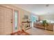 Front entry with tiled floor, white door, and console table at 5159 Oakmont Pl, Sarasota, FL 34242