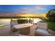 Relaxing patio area with fire pit and waterfront views at 5418 Siesta Cove Dr, Sarasota, FL 34242