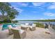 Relaxing patio furniture overlooking the water at 5418 Siesta Cove Dr, Sarasota, FL 34242