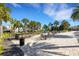 Relaxing poolside patio with tables, chairs, and a bar at 5658 Silverbridge Trl, Bradenton, FL 34211