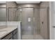 Large walk-in shower with tiled walls and glass enclosure at 5658 Silverbridge Trl, Bradenton, FL 34211