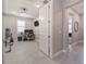 Hallway with access to home office and other rooms at 7675 Summerland Cv, Bradenton, FL 34202