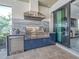 High-end outdoor kitchen with stainless steel appliances and marble countertops at 7675 Summerland Cv, Bradenton, FL 34202