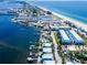 Aerial view of coastal town with waterfront property and beach at 1007 Gulf N Dr # 106, Bradenton Beach, FL 34217