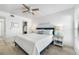 Relaxing bedroom with ceiling fan and ensuite bathroom at 1007 Gulf N Dr # 106, Bradenton Beach, FL 34217