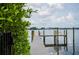 Private dock with walkway leading to the water at 1007 Gulf N Dr # 106, Bradenton Beach, FL 34217
