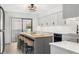Modern kitchen with gray cabinets, a large island, and stainless steel appliances at 1007 Gulf N Dr # 106, Bradenton Beach, FL 34217