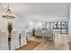 Spacious living room with light flooring and access to a balcony at 1007 Gulf N Dr # 106, Bradenton Beach, FL 34217