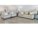 Light and airy living room featuring a neutral color palette and ample seating at 1007 Gulf N Dr # 106, Bradenton Beach, FL 34217