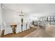 Spacious living room with light flooring and access to a balcony at 1007 Gulf N Dr # 106, Bradenton Beach, FL 34217