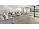 Living area showcasing sliding glass doors leading to a balcony at 1007 Gulf N Dr # 106, Bradenton Beach, FL 34217