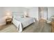 Primary bedroom with a king-size bed and wood dresser at 1007 Gulf N Dr # 106, Bradenton Beach, FL 34217