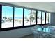 Stunning ocean view from sunroom with patio furniture at 1007 Gulf N Dr # 106, Bradenton Beach, FL 34217