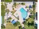 Inviting community pool with surrounding tropical landscaping at 1007 Gulf N Dr # 106, Bradenton Beach, FL 34217