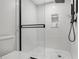 Clean and bright shower with subway tile and glass door at 1007 Gulf N Dr # 106, Bradenton Beach, FL 34217