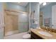 Updated bathroom with tub and granite vanity at 1035 Bradberry Dr, Nokomis, FL 34275