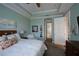 Relaxing bedroom with ceiling fan, ensuite bathroom access, and ample natural light at 1035 Bradberry Dr, Nokomis, FL 34275