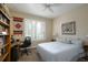 Comfortable guest bedroom with a workspace and plenty of natural light at 1035 Bradberry Dr, Nokomis, FL 34275