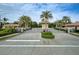 Gated community entrance with palm trees and landscaping at 1035 Bradberry Dr, Nokomis, FL 34275
