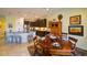 Kitchen island with seating and adjacent dining area at 1035 Bradberry Dr, Nokomis, FL 34275