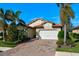 Attractive single-story home with a paved driveway and landscaping at 1035 Bradberry Dr, Nokomis, FL 34275