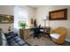 Home office features a corner desk and comfortable seating at 1035 Bradberry Dr, Nokomis, FL 34275