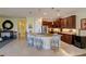 Island kitchen with granite counters, stainless steel appliances, and breakfast bar at 1035 Bradberry Dr, Nokomis, FL 34275
