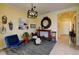 Bright living room with seating area, large mirror and hardwood floors at 1035 Bradberry Dr, Nokomis, FL 34275