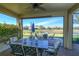 Enjoy outdoor dining on the screened patio overlooking the lake at 1035 Bradberry Dr, Nokomis, FL 34275