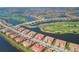 Expansive aerial view of a luxury community near waterways and golf course at 10796 Tarflower Dr # 102, Venice, FL 34293