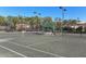 Tennis court with covered seating area at 114 Cipriani Way, North Venice, FL 34275