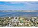 Aerial view of Bradenton, Florida, showcasing waterfront, homes, and a tennis court at 1524 2Nd E Ave, Bradenton, FL 34208