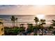 Aerial view of beach, ocean, palm trees, and beach access at 1524 2Nd E Ave, Bradenton, FL 34208