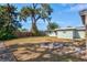 Backyard with large tree, shed and firepit at 1524 2Nd E Ave, Bradenton, FL 34208