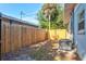 Small backyard with wooden fence and AC unit at 1524 2Nd E Ave, Bradenton, FL 34208