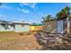 Backyard view of home, shed and firepit at 1524 2Nd E Ave, Bradenton, FL 34208