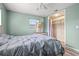Serene bedroom featuring light walls, ceiling fan, and ample closet space at 1524 2Nd E Ave, Bradenton, FL 34208