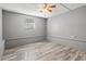 Simple bedroom with wood-look floors and ceiling fan at 1524 2Nd E Ave, Bradenton, FL 34208