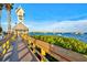 Boardwalk path leading to waterfront with clock tower and boats at 1524 2Nd E Ave, Bradenton, FL 34208