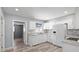 Bright kitchen with white cabinets, granite countertops, and stainless steel appliances at 1524 2Nd E Ave, Bradenton, FL 34208