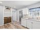 Clean and efficient kitchen with white cabinets and granite countertops at 1524 2Nd E Ave, Bradenton, FL 34208