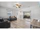 Open living room with L-shaped sectional and built-in shelving at 1524 2Nd E Ave, Bradenton, FL 34208