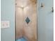 Clean shower with beige tile and a blue mosaic accent at 2155 Wood St # B17, Sarasota, FL 34237
