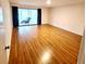 Large bedroom with wood floors and access to lanai at 226 Lakewood Dr # 226, Bradenton, FL 34210