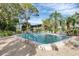 Inviting community pool with lounge chairs and tropical landscaping at 226 Lakewood Dr # 226, Bradenton, FL 34210