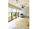 Bright lanai with tiled floors and ceiling fan at 226 Lakewood Dr # 226, Bradenton, FL 34210