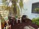 Small, private patio with wicker chairs and a table at 226 Lakewood Dr # 226, Bradenton, FL 34210