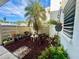 Private condo patio with seating area and tropical plants at 226 Lakewood Dr # 226, Bradenton, FL 34210